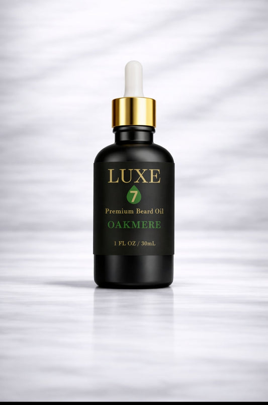 Luxe 7 Oakmere Premium Beard Oil in a 1 fl oz (30 mL) black glass bottle with a gold-and-white dropper on a light marble background.